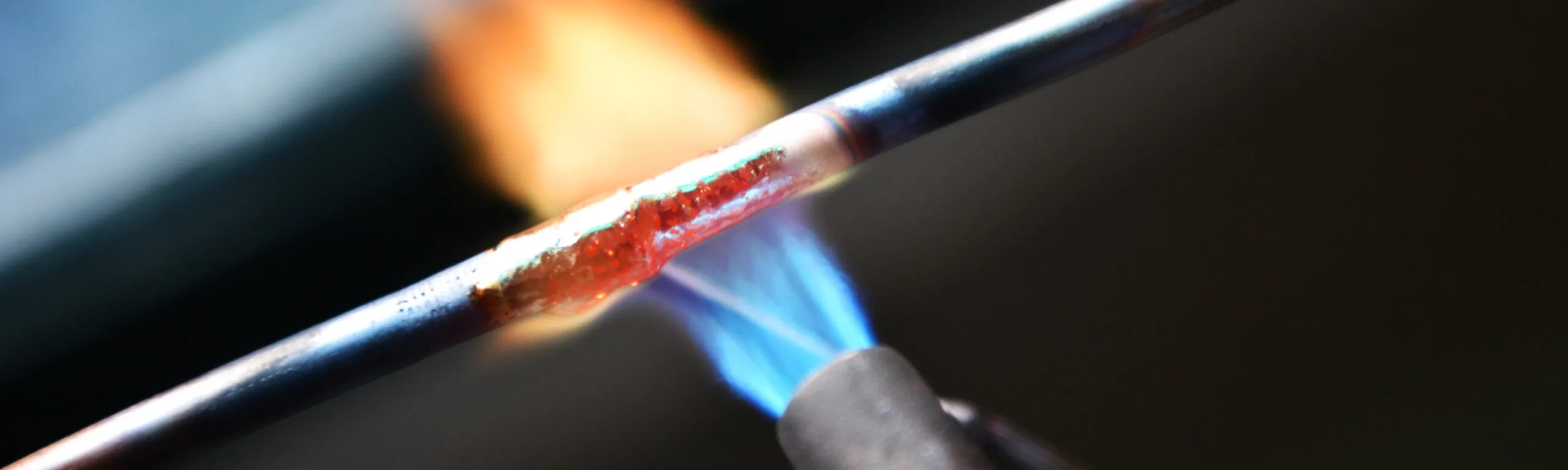 Close-up image of welding showing flame against metal.